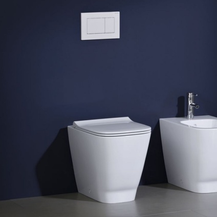 Product Lifestyle Image of Geberit Smyle Square Rimfree/Rimless Back to Wall Fully Enclosed Toilet with Seat in purple bathroom - 500.840.00.1